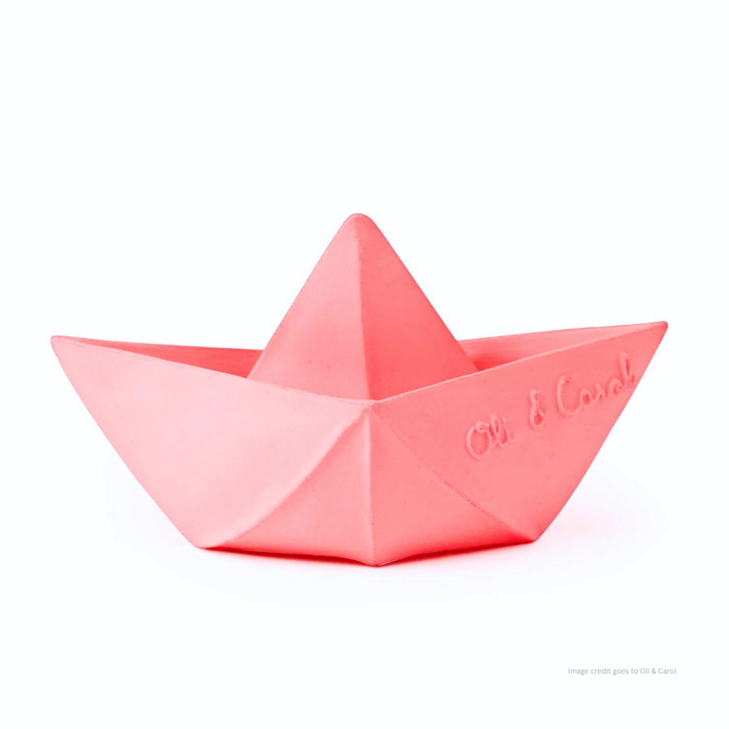 An image of a soft rubber boat toy for baby bath time and it also shows a text that is 'image credit goes to Oli and Carol'.