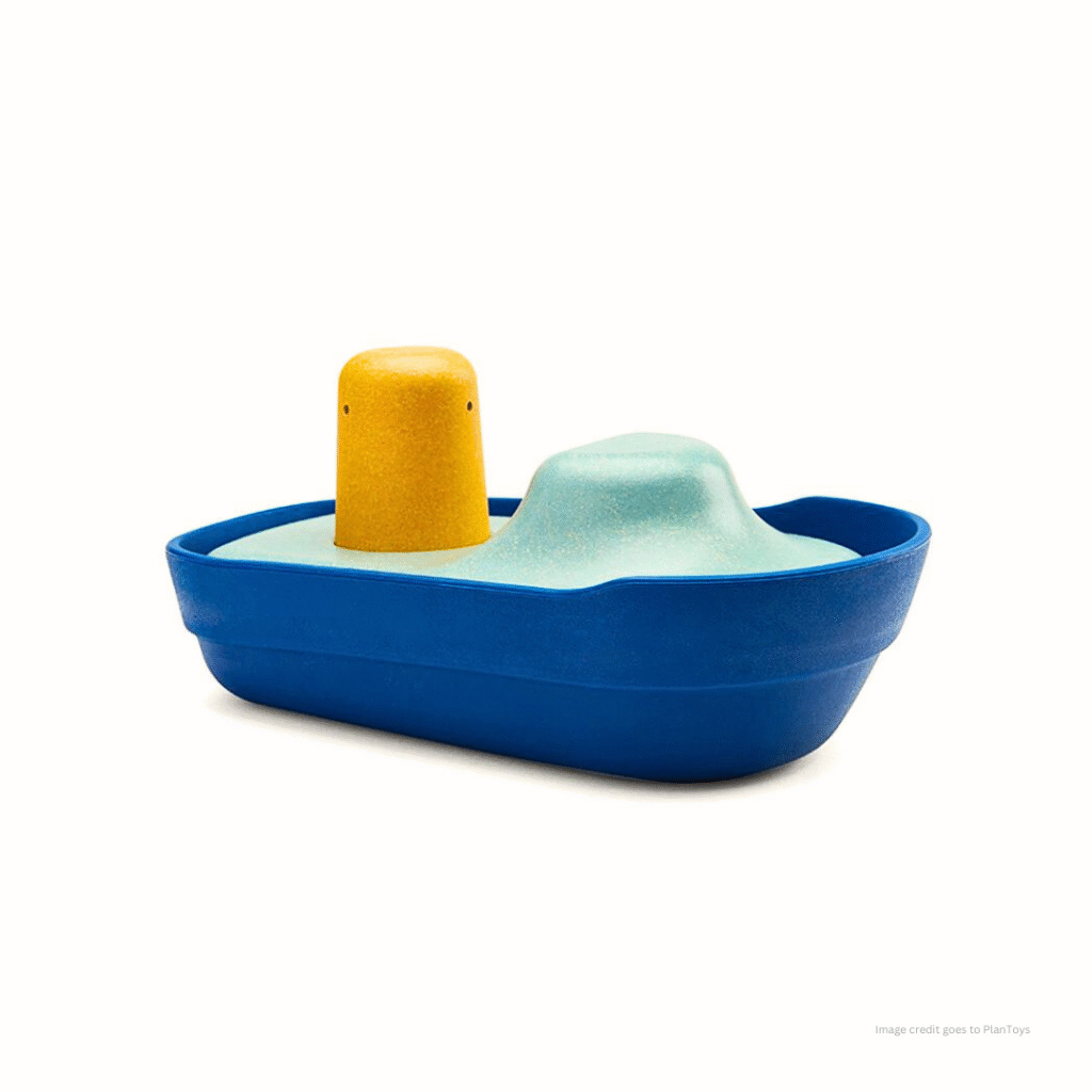 The image shows a wooden boat toy for baby and a clear text - 'image credit goes to PlanToys'.